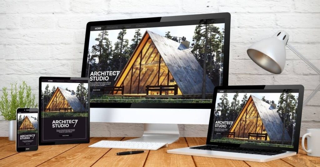 Good business website blog featured image - different screen mockups on wooden table